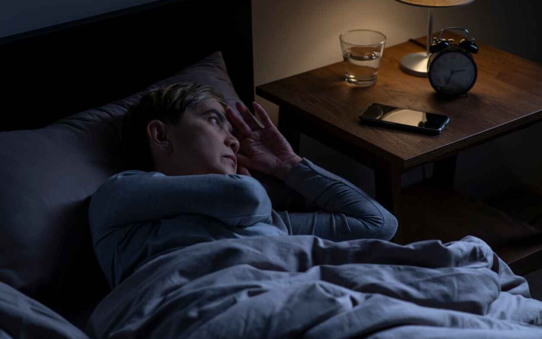 Depressed senior woman lying in bed cannot sleep from insomnia; The Connection Between Sleep and Mental Health