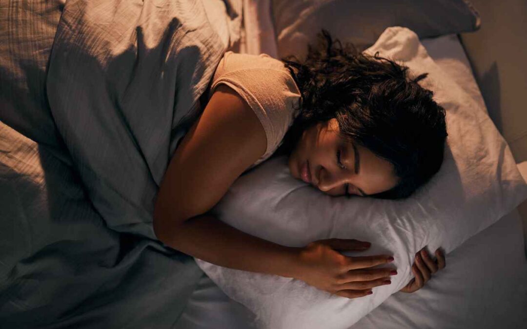 High angle shot of a beautiful young woman sleeping in her bed at home during the night